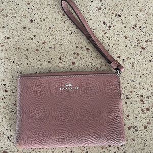 Coach wristlet in mauve color